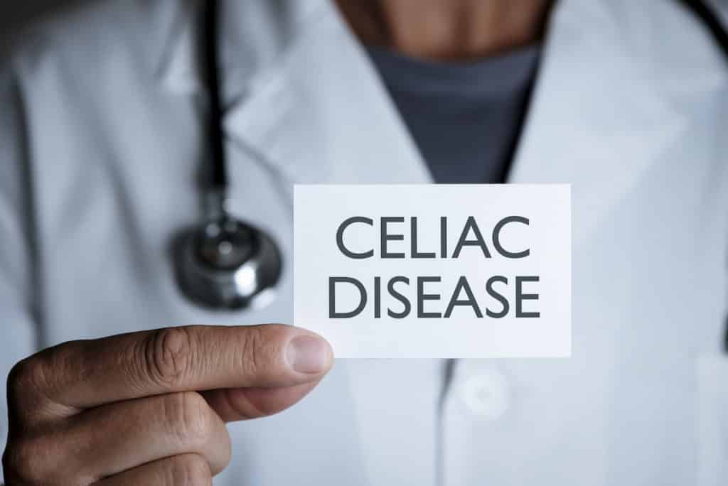 doctor holding a card with celiac disease
